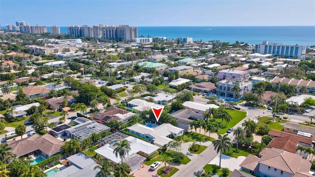 birds eye view of property with a water view