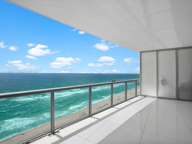 balcony with a view of the beach and a water view