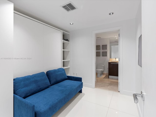 sitting room with tile patterned floors