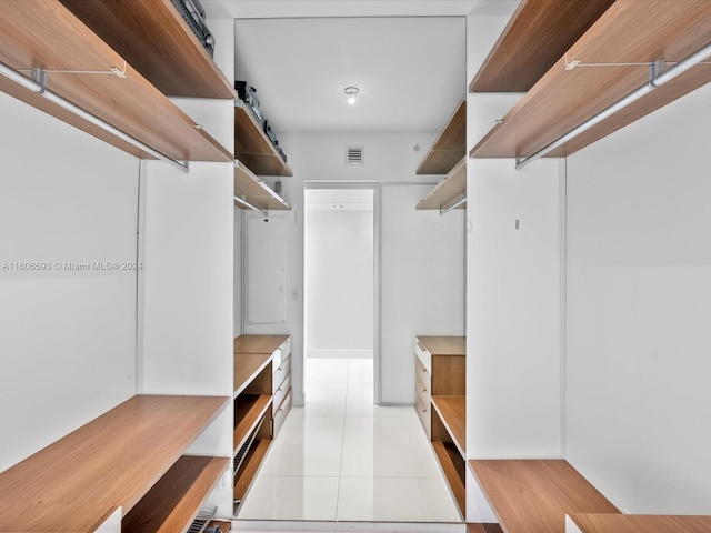 walk in closet featuring light tile patterned floors