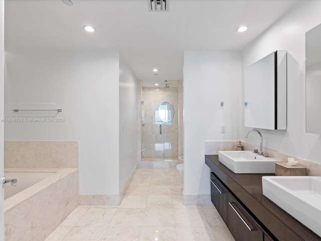 full bathroom with tile patterned flooring, vanity, toilet, and independent shower and bath