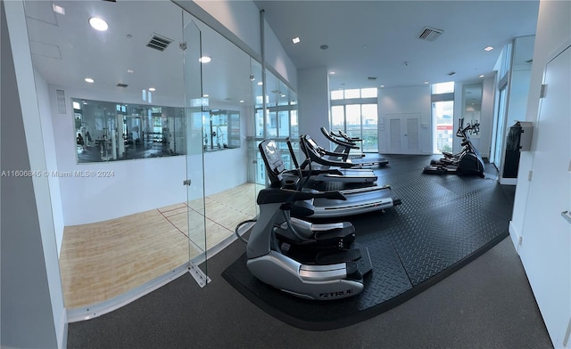 workout area with visible vents and recessed lighting