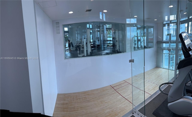gym featuring recessed lighting and visible vents