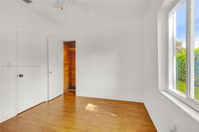 unfurnished bedroom featuring ceiling fan and light hardwood / wood-style flooring