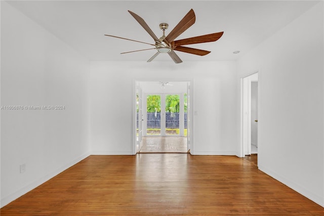 empty room with wood-type flooring and ceiling fan