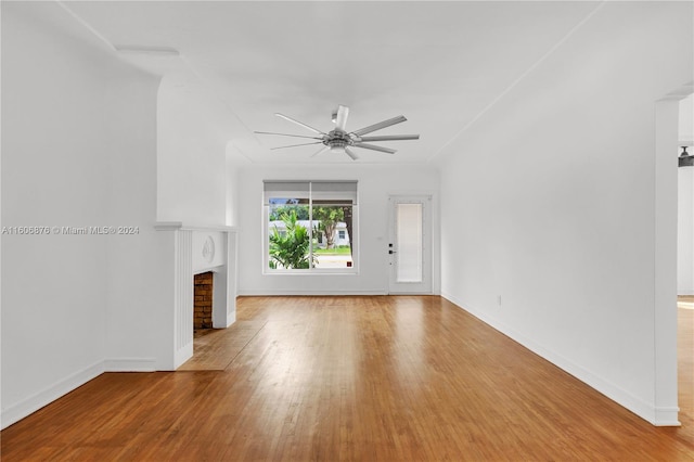 unfurnished living room with ceiling fan and hardwood / wood-style flooring