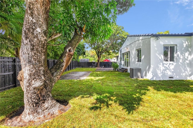 view of yard featuring central AC