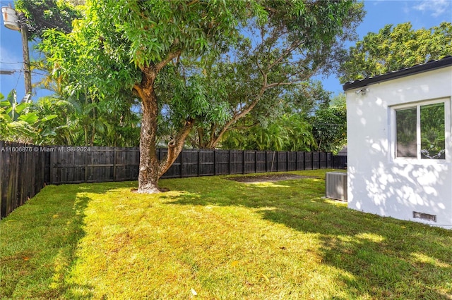 view of yard featuring central AC