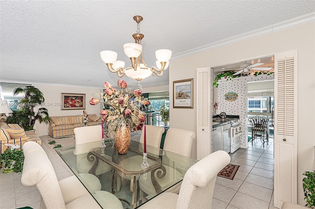 tiled dining area with ornamental molding, a textured ceiling, and a chandelier