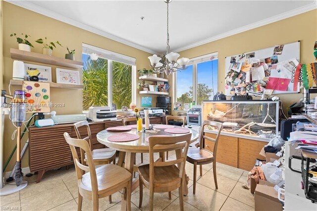 tiled dining area with a chandelier and crown molding