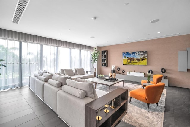 tiled living room featuring a wealth of natural light