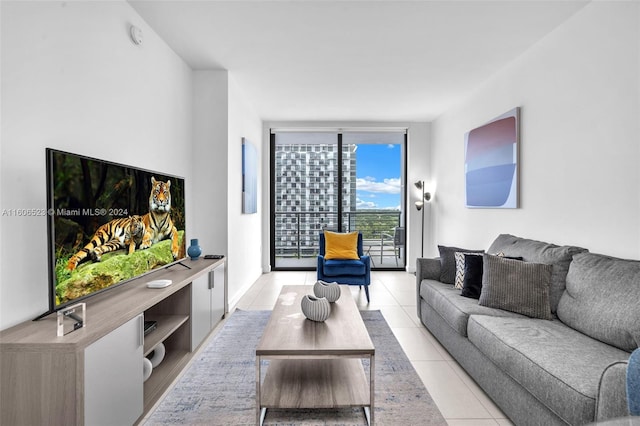 living room with floor to ceiling windows and light tile patterned floors