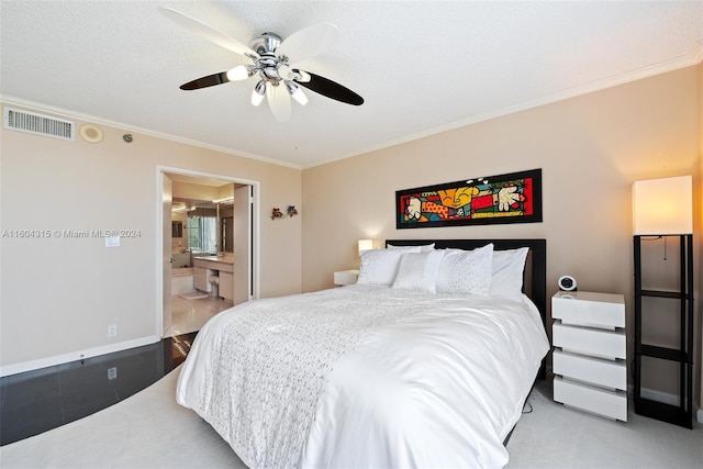 bedroom featuring a textured ceiling, ornamental molding, connected bathroom, ceiling fan, and light tile floors