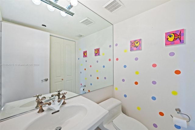 bathroom featuring sink and toilet