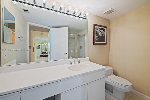 bathroom with tile floors, toilet, and oversized vanity