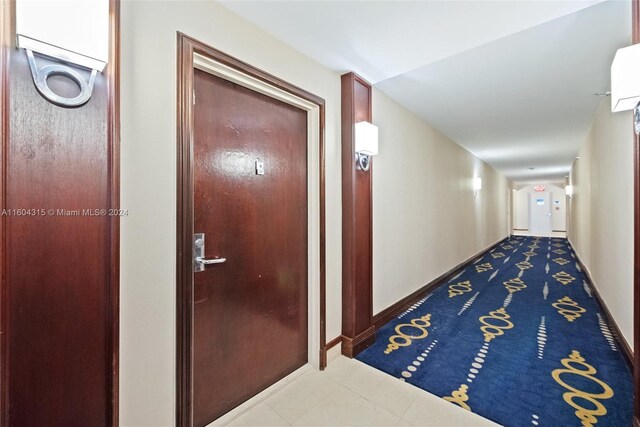 hallway with tile flooring