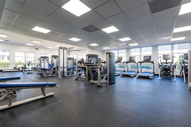 exercise room featuring a paneled ceiling