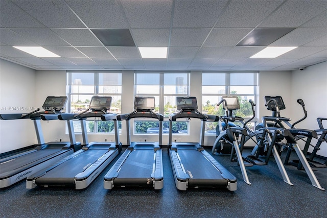 workout area with a paneled ceiling