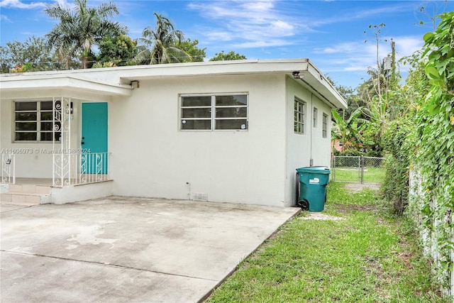 view of property exterior with a patio