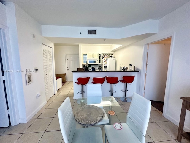 dining room with light tile patterned floors