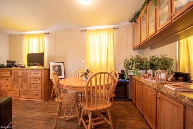 dining room with dark hardwood / wood-style flooring