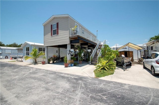 view of front of property with a carport