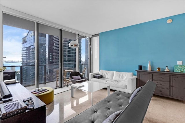 living room featuring floor to ceiling windows and light tile floors