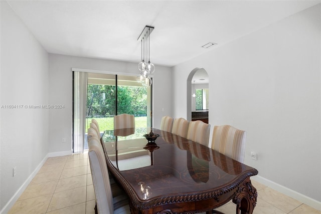 dining area featuring light tile patterned floors