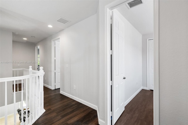 hallway featuring dark wood-type flooring