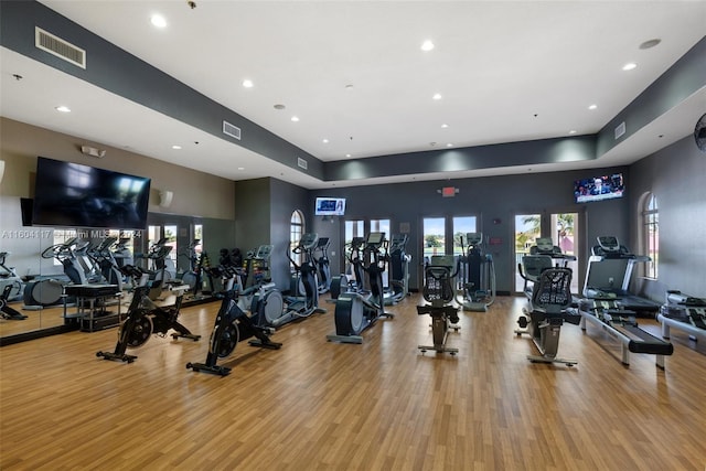 gym with light hardwood / wood-style flooring