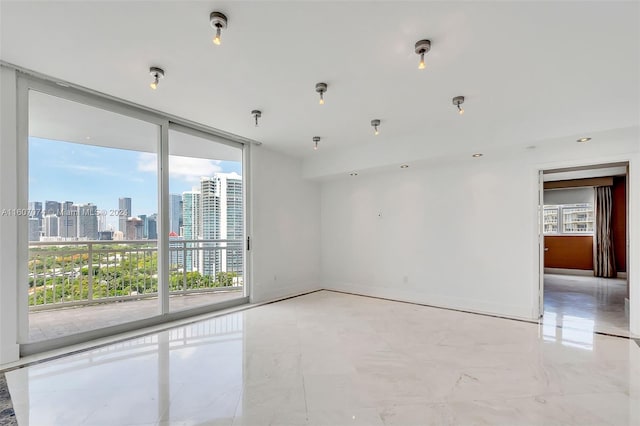 spare room featuring floor to ceiling windows