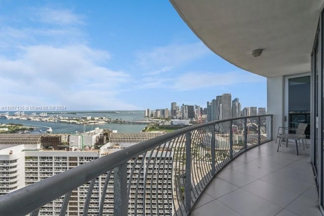 balcony featuring a water view