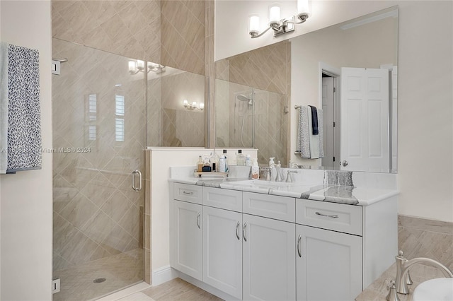 bathroom featuring vanity, tile walls, and an enclosed shower