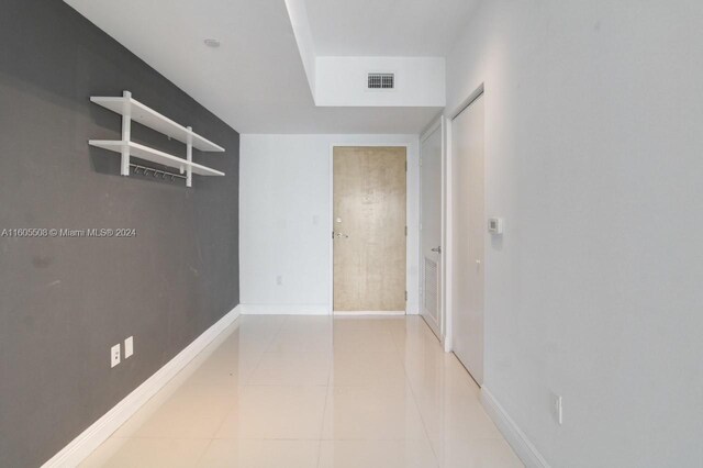 empty room featuring light tile patterned floors