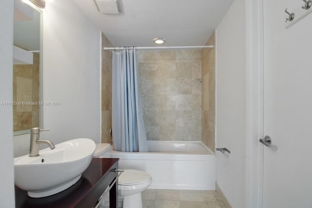 full bathroom featuring visible vents, toilet, shower / bath combo, vanity, and tile patterned floors