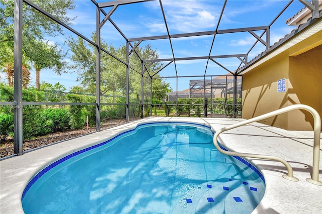 view of pool featuring a patio area and a lanai