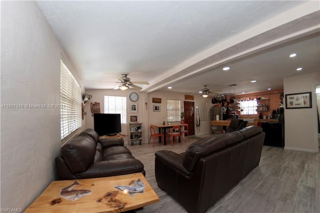 living room featuring recessed lighting, ceiling fan, and light wood-style flooring