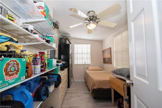 bedroom featuring wood finished floors and a ceiling fan