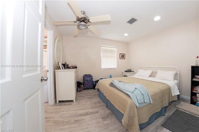 bedroom with a ceiling fan, recessed lighting, visible vents, and light wood-style flooring