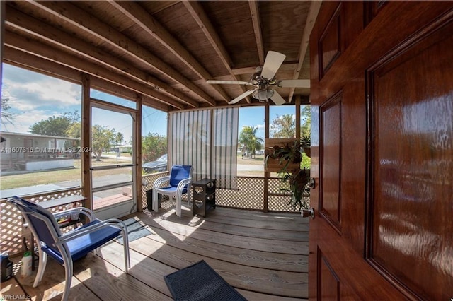 sunroom / solarium featuring ceiling fan