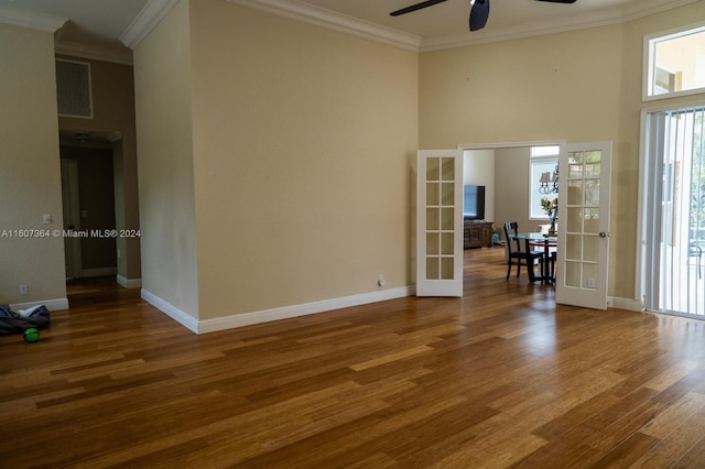 spare room featuring french doors, wood-type flooring, and ceiling fan