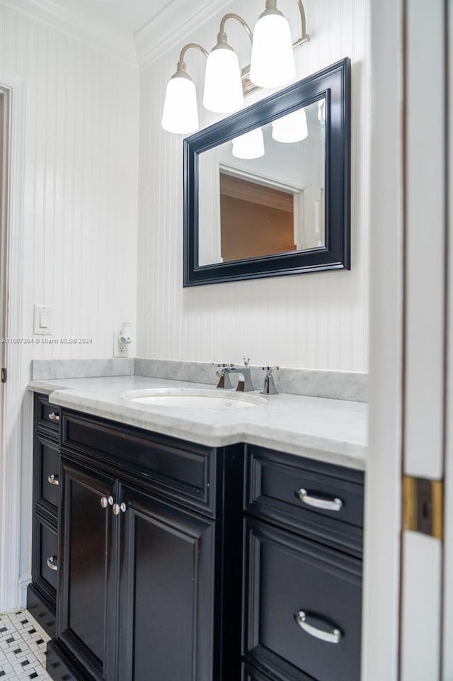 bathroom featuring crown molding, tile flooring, and vanity