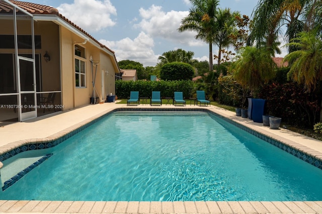 view of pool featuring a patio area