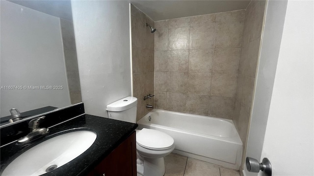 full bathroom with vanity, tile patterned floors, toilet, and tiled shower / bath