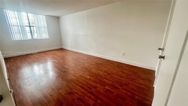 spare room featuring hardwood / wood-style floors