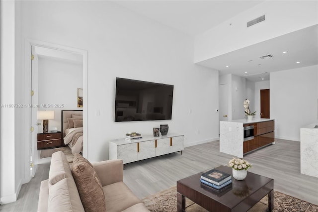 living room with light hardwood / wood-style floors