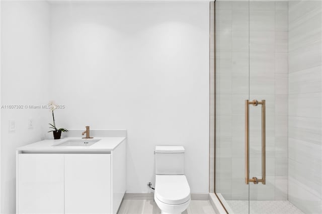 bathroom with vanity, toilet, and an enclosed shower