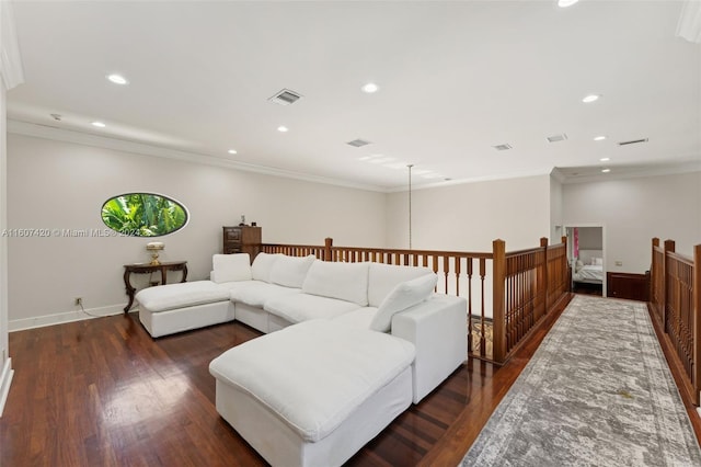 living room with dark wood-type flooring and ornamental molding