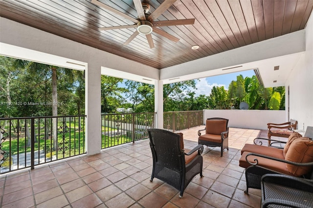 view of patio with outdoor lounge area and ceiling fan