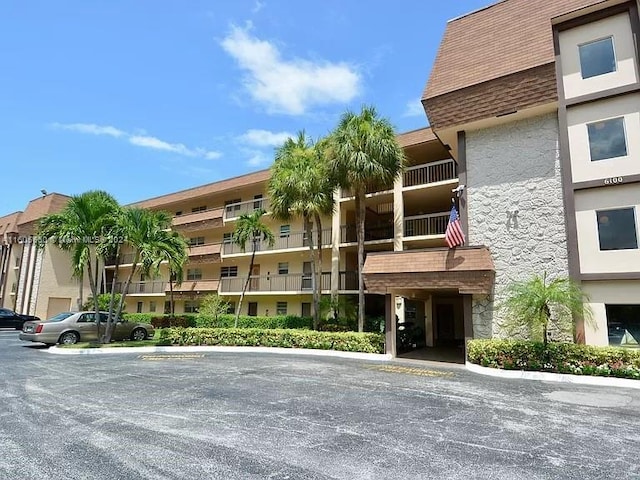 view of property with uncovered parking